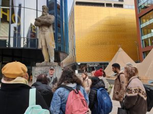 Photo of tour group next to Marx statue