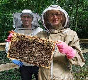Phil Donkersley and Nadia Mazza, two of the LUBK committee members with Nadia holding a frame of bees