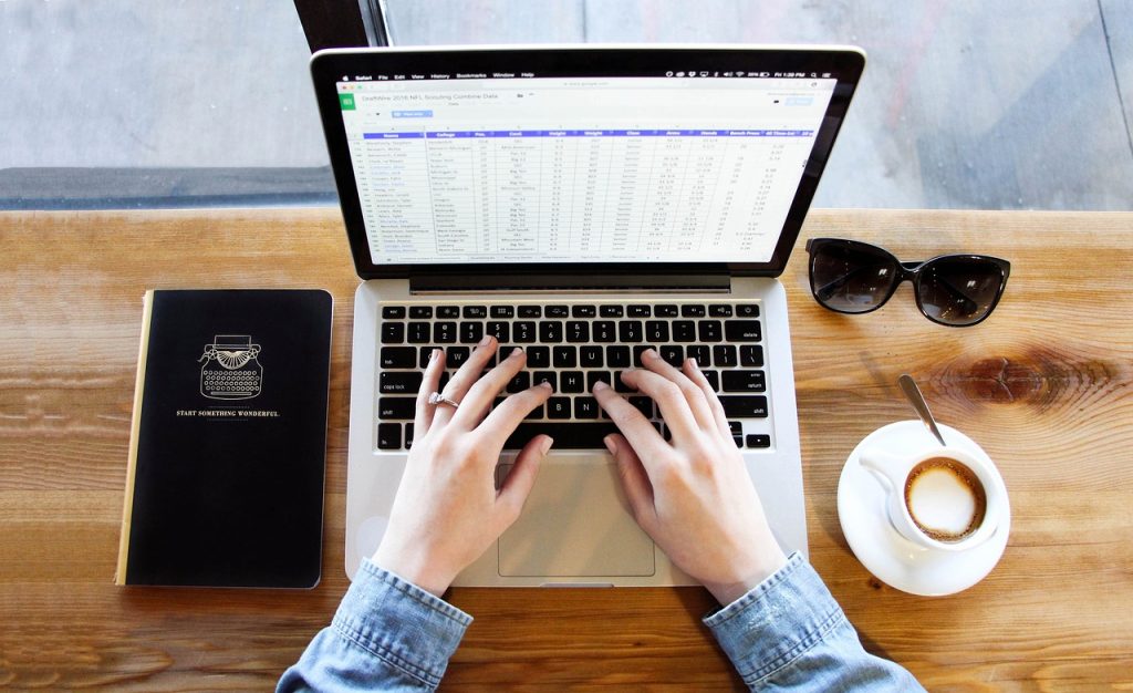 Student typing on a laptop