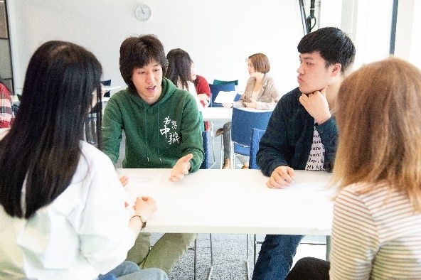 Four students in a discussion group