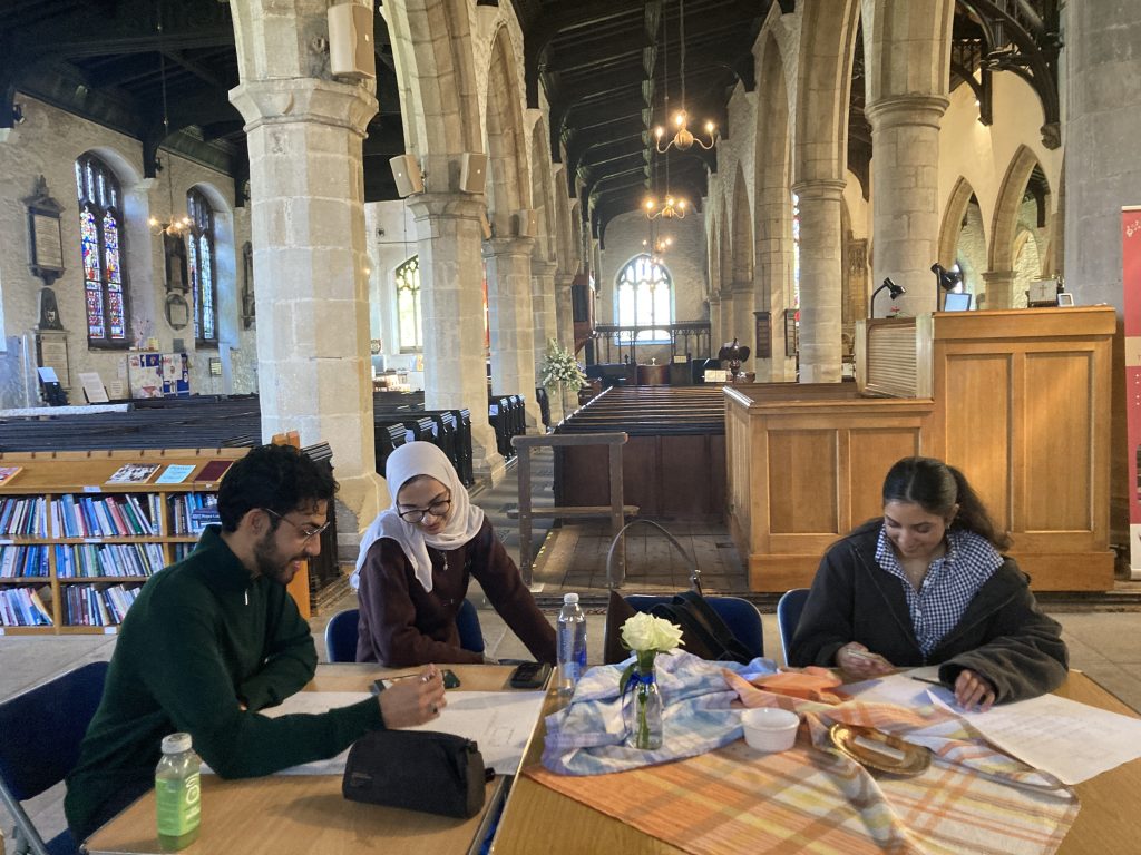 Students in a church attending a design workshop